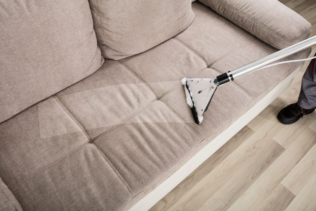 sofa cleaning with vaccum cleaner